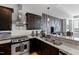 Modern kitchen features granite countertops, stainless steel appliances, and dark wood cabinets at 400 W North St # 1204, Raleigh, NC 27603