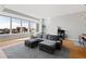 Living room features large windows, hardwood floors, and a comfortable seating area at 400 W North St # 1204, Raleigh, NC 27603
