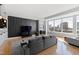 Open living space featuring city views from expansive windows and modern finishes at 400 W North St # 1204, Raleigh, NC 27603