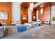 Grand lobby with wood paneled walls, comfortable seating, pendant lights, and marble flooring at 400 W North St # 1204, Raleigh, NC 27603