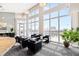 Amenity lounge area with floor to ceiling windows providing ample natural light at 400 W North St # 1204, Raleigh, NC 27603