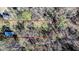 An aerial view showing property lines of a wooded lot with a barn at 408 Rand Rd, Raleigh, NC 27603