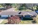 Expansive aerial view of the property with a detached garage, mature trees, and ample green space at 408 Rand Rd, Raleigh, NC 27603