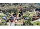 Estate aerial view shows property lines with mature trees, a house, outbuildings, and fenced road frontage at 408 Rand Rd, Raleigh, NC 27603