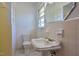 Bathroom with a white toilet, sink and medicine cabinet at 408 Rand Rd, Raleigh, NC 27603