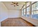 Bright living room with hardwood floors, vaulted ceilings, and many windows at 408 Rand Rd, Raleigh, NC 27603