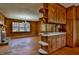 A living room features a large window, wood paneling and a fireplace at 408 Rand Rd, Raleigh, NC 27603