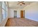 Sunlit room featuring beautiful hardwood floors and light-filled windows, offering lots of space at 408 Rand Rd, Raleigh, NC 27603