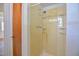 Shower area with a handheld shower head and cream colored walls at 408 Rand Rd, Raleigh, NC 27603