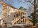 Spacious backyard with a screened deck, patio, and white picket fence, perfect for outdoor relaxation and entertaining at 424 Hocutt Farm Dr, Clayton, NC 27527