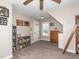 A bedroom with a ladder, built-in bookcase, neutral walls, and a ceiling fan at 424 Hocutt Farm Dr, Clayton, NC 27527