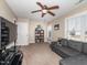 Comfortable bedroom with sofa, ceiling fan, and natural light, offers versatile living space at 424 Hocutt Farm Dr, Clayton, NC 27527