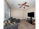 Bonus room complete with ceiling fan, large windows, and entertainment setup for relaxation at 424 Hocutt Farm Dr, Clayton, NC 27527