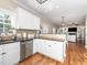 Kitchen features granite countertops, stainless steel appliances, and access to living area at 424 Hocutt Farm Dr, Clayton, NC 27527