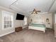 Spacious main bedroom features a tray ceiling, natural light, and neutral decor at 424 Hocutt Farm Dr, Clayton, NC 27527
