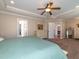 Bright main bedroom with a ceiling fan and entry to the bathroom and walk-in closet at 424 Hocutt Farm Dr, Clayton, NC 27527