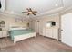 A spacious main bedroom featuring a ceiling fan, tray ceiling, and neutral walls at 424 Hocutt Farm Dr, Clayton, NC 27527