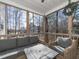 Relaxing screened porch with comfortable seating provides views of the surrounding lush trees at 424 Hocutt Farm Dr, Clayton, NC 27527