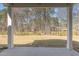 View of the large backyard from the covered patio, perfect for outdoor activities and relaxation at 4320 Stony Falls Way, Knightdale, NC 27545