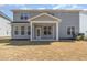 Charming backyard featuring a covered patio, offering an ideal space for outdoor gatherings and relaxation at 4320 Stony Falls Way, Knightdale, NC 27545