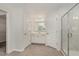 Bright bathroom with white cabinetry, tiled floors, and glass shower at 4320 Stony Falls Way, Knightdale, NC 27545