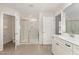Bathroom featuring a spacious walk-in shower and dual sink vanity at 4320 Stony Falls Way, Knightdale, NC 27545