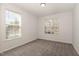 Comfortable bedroom featuring neutral carpet, natural light and freshly painted walls at 4320 Stony Falls Way, Knightdale, NC 27545