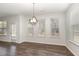 Dining room features a modern chandelier and natural light at 4320 Stony Falls Way, Knightdale, NC 27545