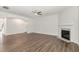 Bright living room features wood flooring and a modern fireplace at 4320 Stony Falls Way, Knightdale, NC 27545