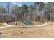 Community playground with swings and slide, perfect for to enjoy outdoor activities in a safe environment at 4320 Stony Falls Way, Knightdale, NC 27545