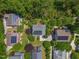 Aerial view of homes with solar panels surrounded by lush greenery at 445 S Greensboro St, Carrboro, NC 27510