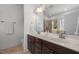 Bathroom features double vanity sinks, a large mirror, and tiled floors, complemented by a separate shower at 445 S Greensboro St, Carrboro, NC 27510