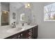 Bright bathroom with double vanity, large mirror, and plenty of natural light from the window at 445 S Greensboro St, Carrboro, NC 27510