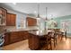 Gourmet kitchen with a large island, stainless appliances, and open layout to the dining area at 445 S Greensboro St, Carrboro, NC 27510