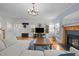 Inviting living room featuring hardwood floors, a fireplace, and neutral decor at 445 S Greensboro St, Carrboro, NC 27510