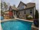 Inviting backyard with a swimming pool, patio, and ample space for outdoor entertaining at 45 Carriden Dr, Youngsville, NC 27596
