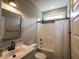 Bathroom with a bathtub, shower, modern sink, vanity, and light fixtures at 45 Carriden Dr, Youngsville, NC 27596
