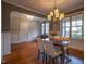 Inviting dining room with hardwood floors, a stylish chandelier, and plenty of natural light at 45 Carriden Dr, Youngsville, NC 27596