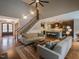 Open-concept living space with hardwood floors and staircase that connects to a modern kitchen at 45 Carriden Dr, Youngsville, NC 27596