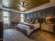 Luxurious main bedroom featuring a unique ceiling design, plush carpet, and stylish furnishings at 45 Carriden Dr, Youngsville, NC 27596