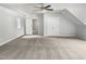 Bedroom featuring neutral carpet, a ceiling fan, a closet, a view to other rooms, and white walls at 4601 Pemberton Dr, Raleigh, NC 27609