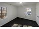 This bedroom has carpet, two windows with natural light and white trim and walls at 4601 Pemberton Dr, Raleigh, NC 27609