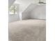 Bright bedroom featuring neutral carpet, white walls, a ceiling fan, and a bright window at 4601 Pemberton Dr, Raleigh, NC 27609