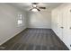 The bedroom features carpeting, neutral paint, a large window and closet at 4601 Pemberton Dr, Raleigh, NC 27609