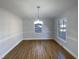 This dining room has hardwood floors and neutral paint with natural light at 4601 Pemberton Dr, Raleigh, NC 27609