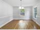 Bright dining room with hardwood floors, crown molding, neutral walls, and plenty of natural light at 4601 Pemberton Dr, Raleigh, NC 27609