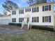 Traditional two-story home featuring white siding, black shutters, and manicured landscaping at 4601 Pemberton Dr, Raleigh, NC 27609