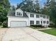 Charming two-story home with a well-manicured lawn, garage, and beautiful curb appeal at 4601 Pemberton Dr, Raleigh, NC 27609