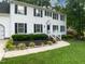 Charming two-story home with black shutters, white trim, and a landscaped front yard for curb appeal at 4601 Pemberton Dr, Raleigh, NC 27609