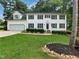 Charming two-story home with a well-manicured lawn, garage, and beautiful curb appeal at 4601 Pemberton Dr, Raleigh, NC 27609